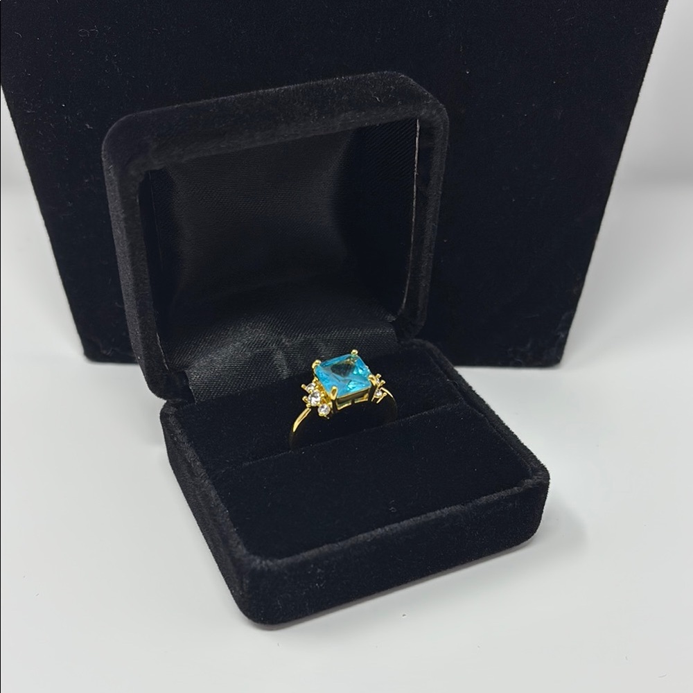 Gold and Blue Ring with Triple Stone Sides